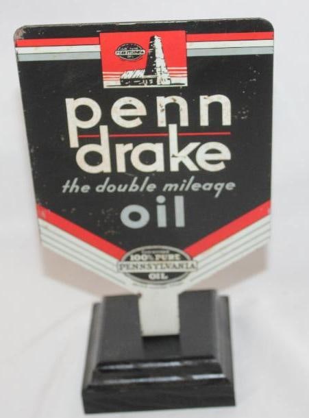 Penn Drake Motor Oil DST Paddle Sign: Both sides of this sign show some light wear throughout the field. One side has some slight flaking to the white areas. This sign is mounted to a wood base. It measures 5" x 8" and the display side is