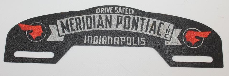 Meridian Pontiac Indianapolis Metal License Plate Topper: This license plate topper is in very good condition with very light wear. This license plate topper measures 10" x 2.25" and is graded an 8.75.