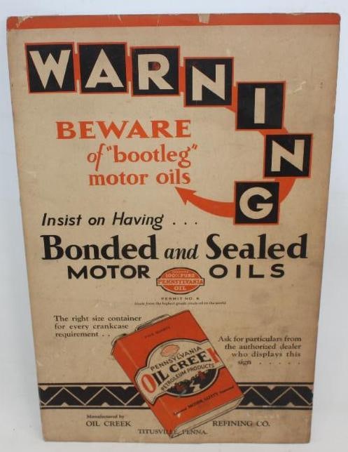 Oil Creek Refining Co. Advertising Warning Display Sign: This sign shows some slight wear and discoloration throughout. There are some small tears shown along the perimeter. This sign measures 22" x 14" and is graded an 8.