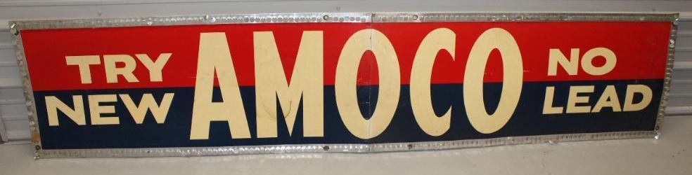 NOS Amoco Try New No Lead Advertising Sign Bordered with Wind Flutter Tabs in Original Box: This sign is in very good overall condition with some staining to the white areas. The box measures 20.5" x 48" and the sign measures 20.5" x 96". It is graded an 8.9.