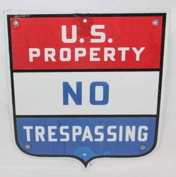 US Property No Trespassing SSP Porcelain Shield Sign: This sign has a small hole added near the top and bottom edges. There are also some touch ups done around those holes. This sign measures 14" x 12" and is graded a 7.5.