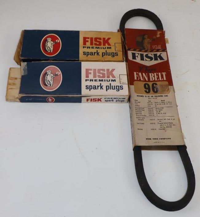 Group of 13 Fisk Advertising Premium Spark Plugs and Fan Belt: Largest is 18" x 4.5" x 0.75"