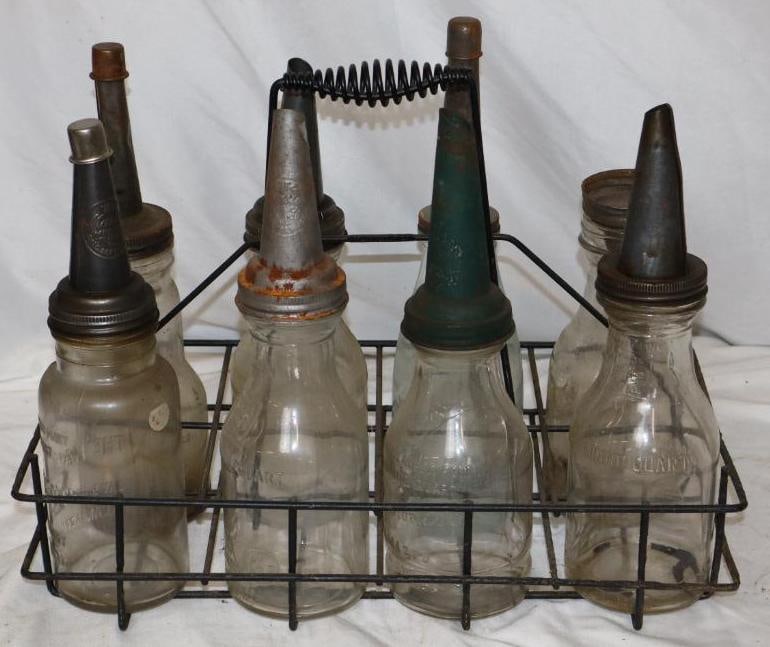 Group of 8 Bulk Oil Glass Bottles with Carrying Rack: Rack measures 19" x 9.5" x 15", Has 1 Dover bottle, 1 handy oiler bottle, 1 Markett, and 1 Kalamazoo bottle, the rest are plain