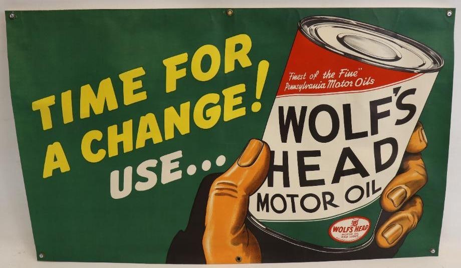Wolf's Head "Time for a Change?" Advertising Banner: This heavy cardstock banner is in very good overall condition and is likely new old stock. It has vibrant colors and great detailed graphics. It does have some minor creases from storage, and it is mo