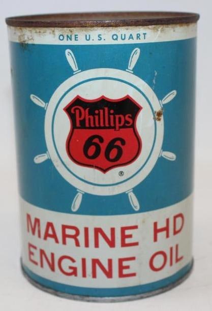 Phillips 66 Marine HD Metal One Quart Oil Can: This desirable can with ship's wheel graphics remains full. It has some slight discoloration and appears to have been clear coated long ago. There are also some small areas of rust staining. It measur