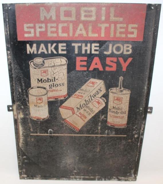 Mobil Specialties Make the Job Easy SST Advertising Rack Sign: This is a very difficult to find early Socony-Vacuum product rack sign. It does show some crazing to the paint. There is light surface staining and rust throughout the field. This sign measures 18" x 