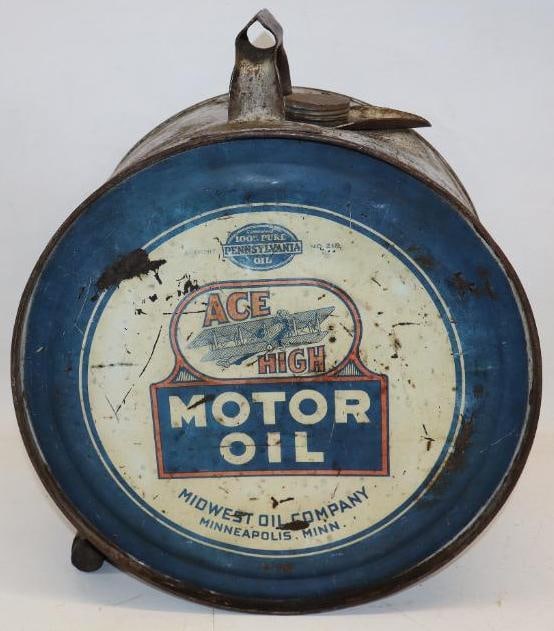 Ace High Five Gallon Rocker Oil Can: This can has very detailed biplane grapgics on each side. The display side has some slight fading in the red, as well as some scratches and wear to the field. The reverse has heavier wear throughout. 