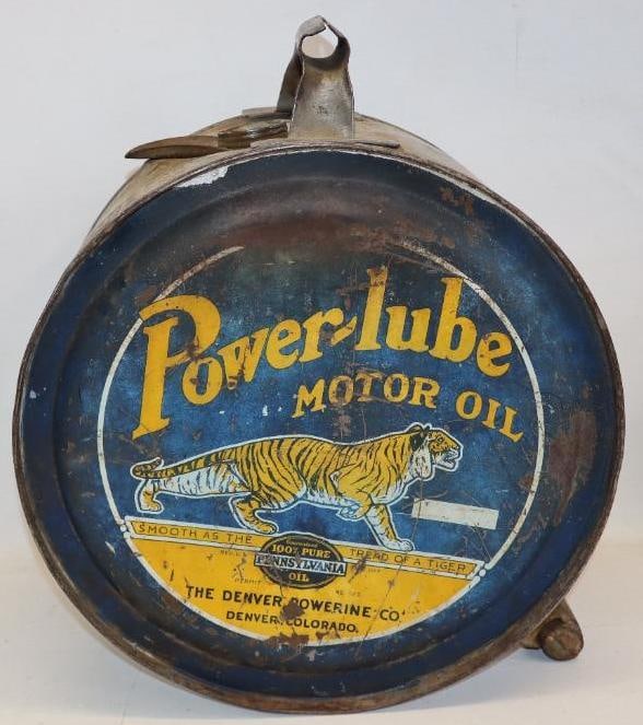 Graphic Power-Lube Five Gallon Rocker Oil Can: This can is missing the screw on cap. The display side shows scratches and wear throughout. While the reverse also has some scratching and wear, there is also some fading to the blue areas. This can m