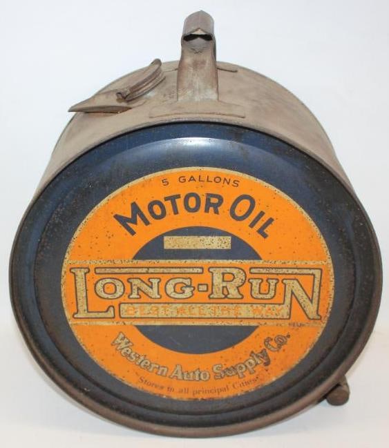 Western Auto Supply CO. Long-Run Motor Oil Five Gallon Rocker Oil Can: Both sides show good coloring with some rust staining throughout each display side. It is in overall very good condition for a rocker. This can measures 17" x 14" x 8.5". It is graded an 8.25 on the d