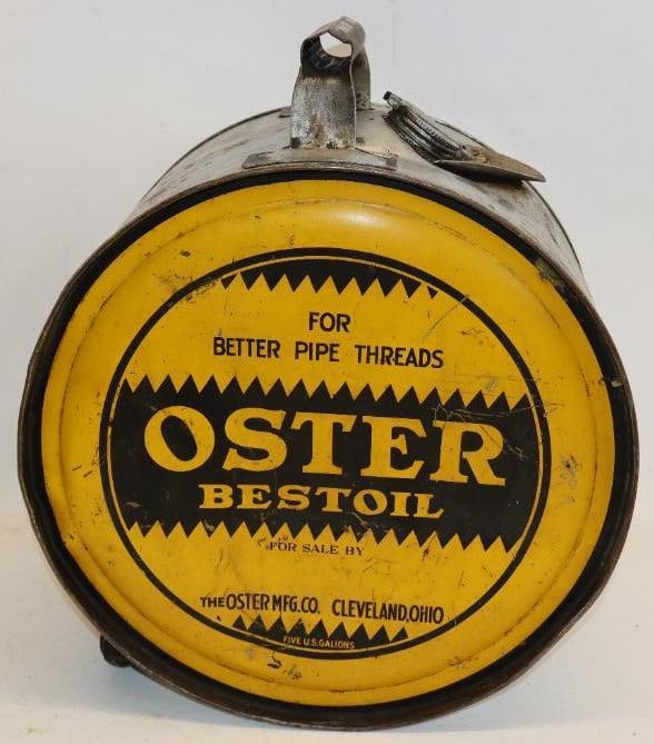 Oster Bestoil Five Gallon Rocker Oil Can: The display side shows some light surface scratches and wear throughout the field. The reverse shows some discoloration and slight wear throughout the field. This can measures 14" x 17" x 8.5". It is 