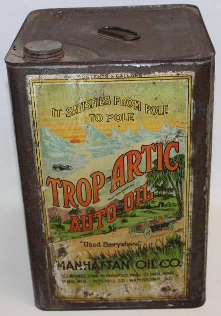 Trop-Arctic Auto Oil Five Gallon Metal Oil Can: This is a great early graphic five gallon can with detailed graphics an early automobile touring scene. It does show some surface wear and rust staining throughout, but displays well overall. This can