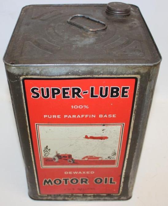 Graphic Super-Lube Dewaxed Motor Oil Five Gallon Metal Oil Can: This can has great graphics including an airplane, tractor, and art deco styled automobile. This can displays very well with some minor staining to the display side. The reverse shows some aditional s