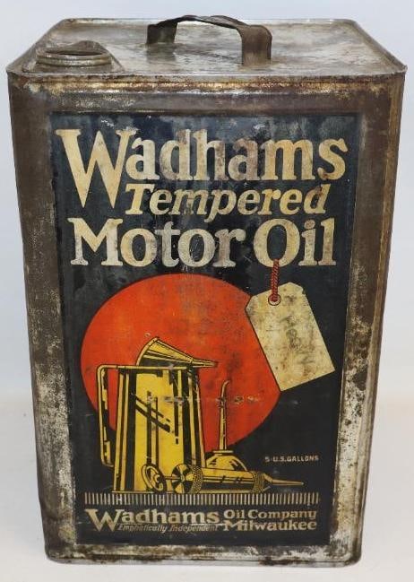 Wadhams Tempered Five Gallon Motor Oil Can: This can shows great detailed graphics. This shows some staining and wear throughout the field. This is a tilt and pour style can with two swivel points on the sides. This can measures 9.5" x 9.75" x 