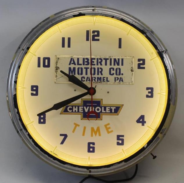 Neon Chevrolet Time Advertising Clock From Albertini Motor Co.: The outer casing of this Lackner clock shows a period correct repaint that is flaking around the perimeter. It lights up and runs. The inner painted face is in excellent overall condition. There is so