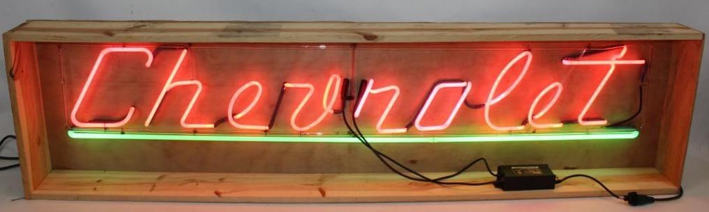 Chevrolet Dealership Pink and Green Neon Light Up Sign: This neon is in good working condition. The new wood crate measures 77.5" x 6.5" x 5.75". The neon itself measures 70.5" x 11.5"