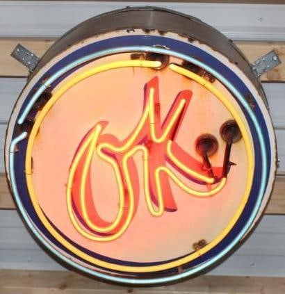 Chevrolet OK Used Cars SSP Porcelain Dealership Neon Advertising Sign: This is a ssp porcelain sign mounted to a stainless steel can. The yellow shows some fading along with some rust staining along the perimeter. The field is free of any chips. This neon is in good work