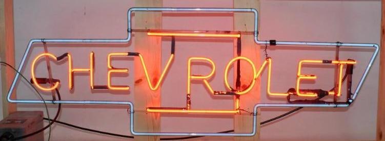 Chevrolet Bowtie Dealership Red and Blue Neon Light Up Sign: This neon is in good working condition. The new wood crate measures 56" x 12" x 13". The neon itself measures 48" x 16.5".