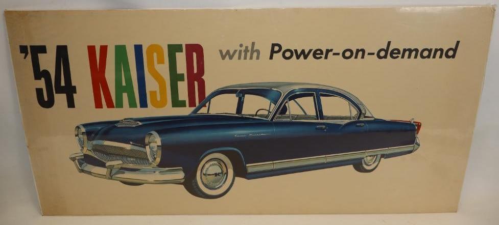 1954 Kaiser Manhattan Dealership Poster: This poster is displayed with shrink wrap over a foam board backing. It is in great overall condition with slight wear throughout. It has great colors throughout, along with great detailed automobile 