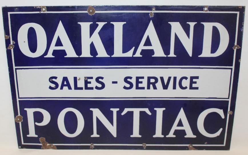 1926-1931 Oakland Pontiac Sales and Service DSP Porcelain Advertising Sign: The display side of this sign shows good color and gloss throughout with a few small chips to the field, as well as chips at the mounting holes. The reverse shows some slight discoloration to the blue