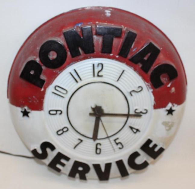 1956 Pontiac Service Advertising Clock: This is a very difficult to find clock in any condition as it is made out of a fragile embossed plastic material. The plastic is in excellnt overall condition with a few minor chips along the outer pe