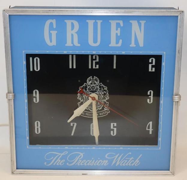 Gruen "The Precision Watch" Neon Advertising Clock: This clock retains its original outer glass face and can with original paint. It also has remnants of lackner label remaining on the back. The neon lights up and the clock is in working order. It is g
