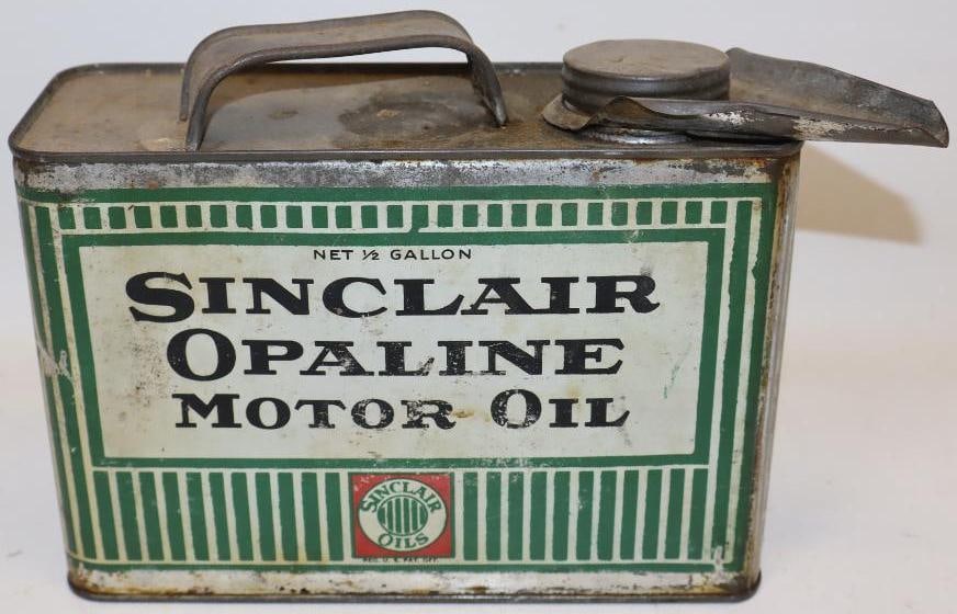 Sinclair Opaline Striped Half Gallon Metal Oil Can: This can measures 9" x 4" x 7". It shows some light wear and staining on each side. It is graded a 8 on the display side and a 7.75 on the reverse.
