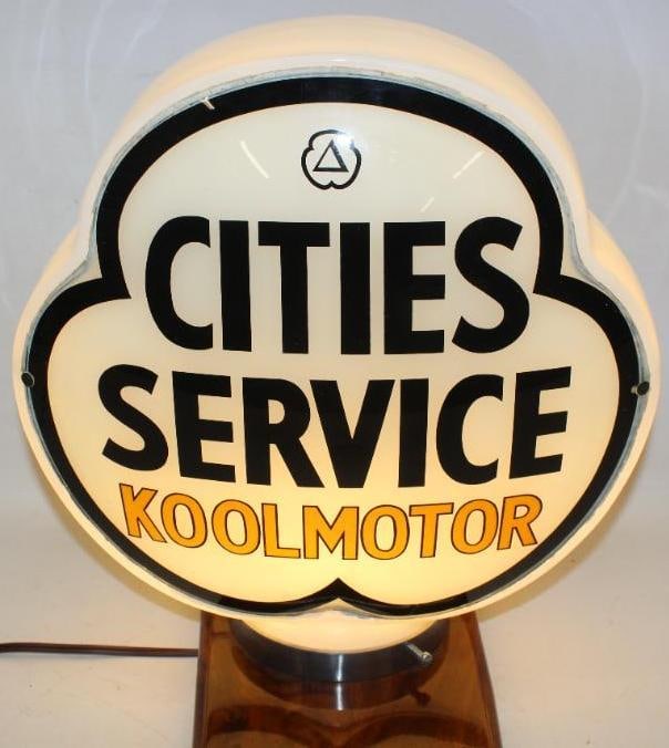 Complete Cities Service Cool Motor Clover Shaped Milk Glass Gas Pump Globe: Both lenses are in excellent overall condition and are caulked in to the original clover shaped milk glass body. The body does have a crack running across one side, but it remains stable and solid. Th