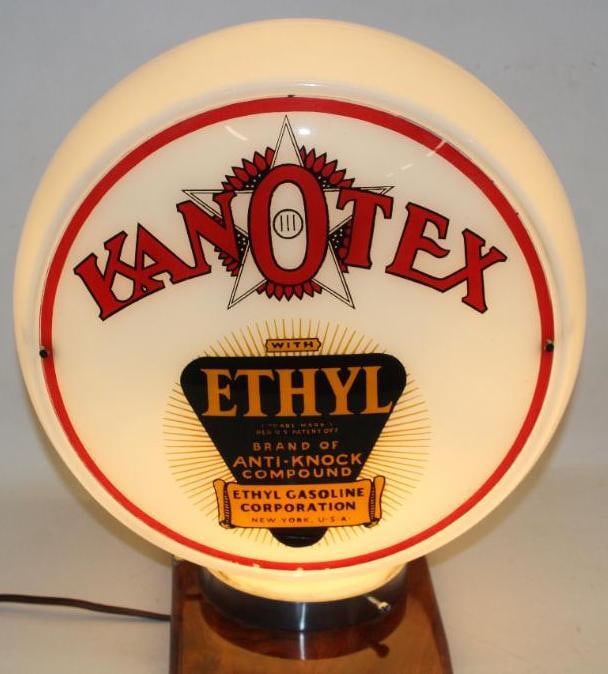 Complete Kanotex Ethyl 13.5" Gas Pump Globe on Wide Milk Glass Body: This is a difficult to find notched version with the red flower. Both lenses are in very good condition. The lenses measure 13.5" Diameter. The overall measurment is 16" x 16" x 9.5".