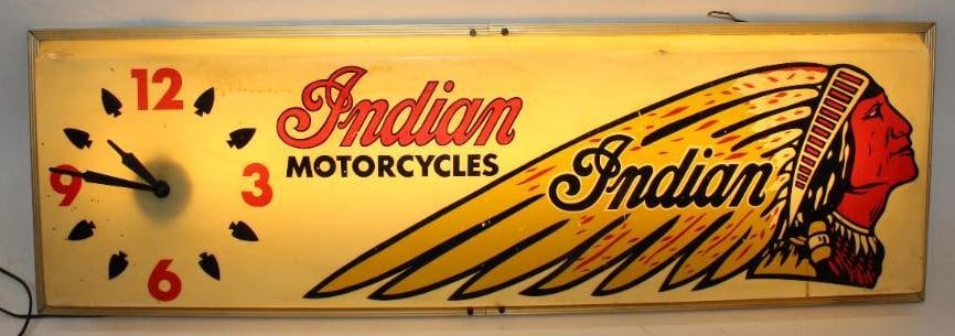Graphic Indian Motorcycles Dealership Light Up Advertising Display Sign and Clock: This excellent display piece shows graphic details with the Indian headdress. The plastic panel shows some staining and discoloration as well as a couple of small cracks and one small chip on the peri