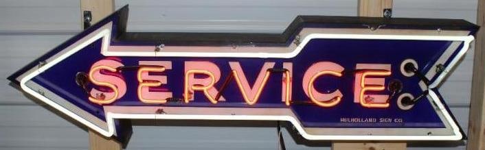 Ford Service Arrow Neon Dealership Advertising Sign: This is a difficult to find and desirable four foot version of the service arrow. It is a ssp porcelain sign on a metal can. The sign does have some slight staining in the white areas but the blue ret