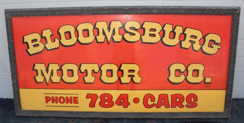 Bloomsburg Motor Co. Dealership Painted Wooden Framed Sign: This sign is made of wood and is in very nice original condition with only minor wear. It retains the original wooden frame. There are a few small holes added near the top edge. This sign is marked Sp