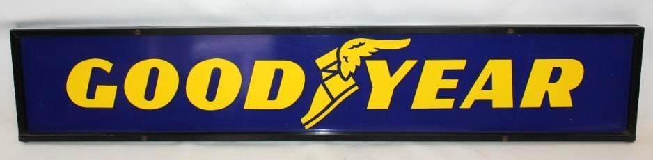 Goodyear Tires DST Framed Tire Rack Topper Sign: Both sides of this sign have good color and gloss throughout. The display side is in excellent condition with only light surface scratches. The reverse has a few more minor surface scratches. This sig