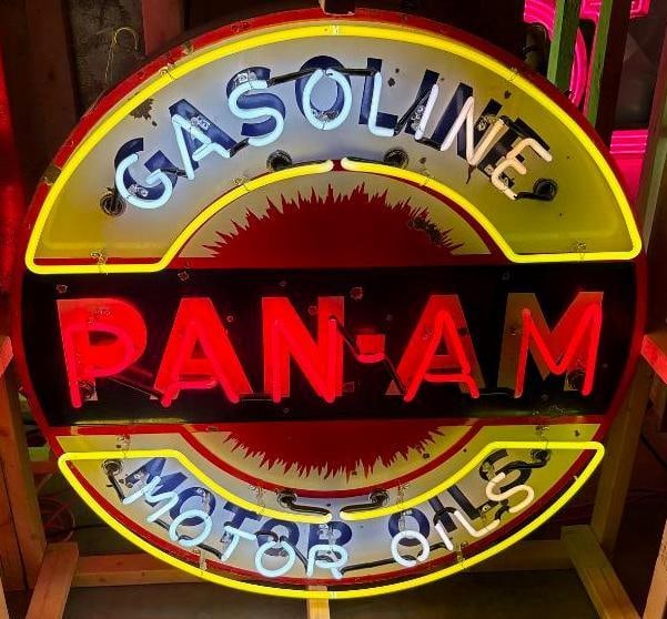 Pan-Am Motor Oils and Gasoline Flashing Neon SSP Porcelain Sign: This sign shows good color and gloss throughout with several small chips to the porcelain. This neon is in good working condition. The neon and can have been added to the original porcelain sign. The 