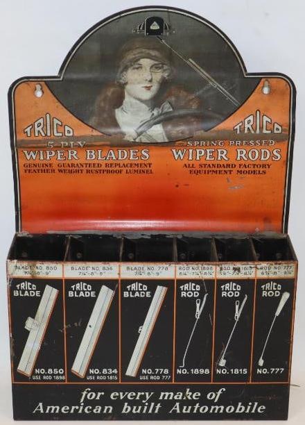 Early Graphic Trico Wiper Blades Advertising Counterop Display: This great early display shows a detailed graphics of a female touring car driver. It shows a bend through the center which resulted in some paint loss. Also, it shows some general fading and wear thr