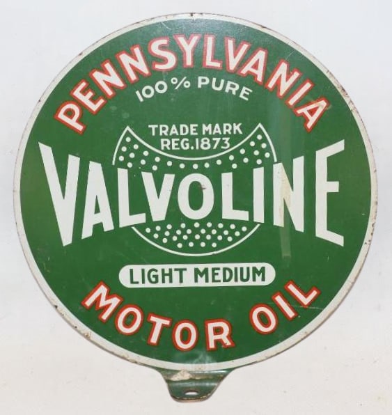 Valvoline Motor Oil DST Lubester Paddle Sign: This sign measures 7" x 7". This sign shows good color with only a stained streak on the display side and some paint flaking on the reverse. It is graded a 8.75 on the display side and a 7 on the reve