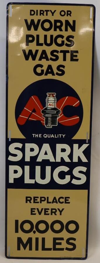 AC The Quality Spark Plugs SST Advertising Sign: This sign is marked A-552. This sign measures 10" x 30". This sign shows great color and gloss with only light surface wear. There is also one small color matched area on the left edge. It is graded a
