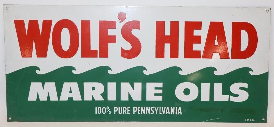 Wolf's Head Marine Oils SST Rack Topper Sign: This sign is marked A-M 8-64. This sign measures 18" x 8". It shows bright colors and only minor surface wear to the field and is graded an 8.75.