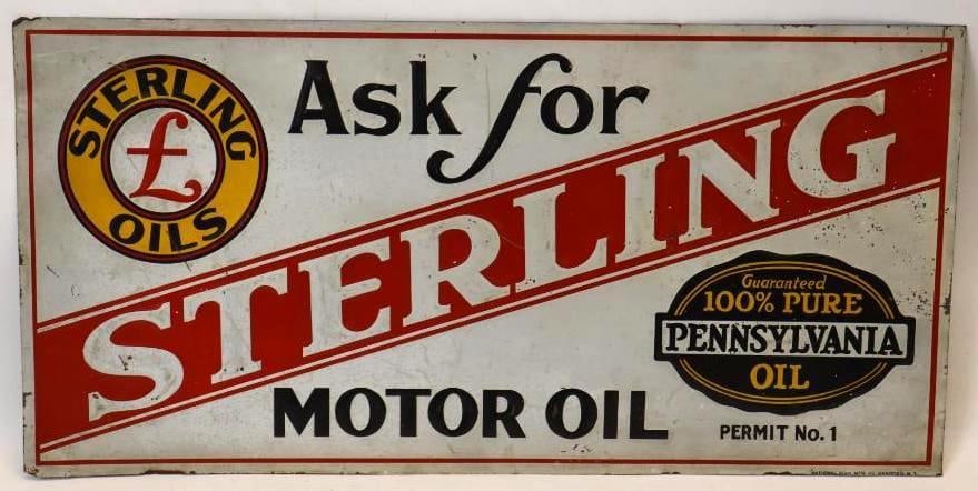 Sterling Motor Oil SST Embossed Advertising Sign: This sign is marked National Sign MFG. Co. Canisteo N.Y. This sign measures 23.75" x 11.75". It shows some slight staining and minor paint flaking. It is graded a 7.75.