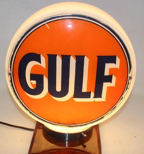 Complete Gulf Oil Company 12.5" Gas Pump Globe on Wide Milk Glass Body: Both lenses show some wear and paint loss around the perimeter. The body is in good condition. The lenses measure 12.5" Diameter. The overall measurments are 14.5" x 14.5" x 8".