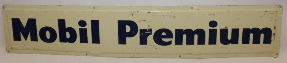 Embossed Mobil Premium Gasoline SST Advertising Sign: This sign has some light surface scratches and wear throughout the field. This sign measures 33.5" x 6.5" and is graded an 8.