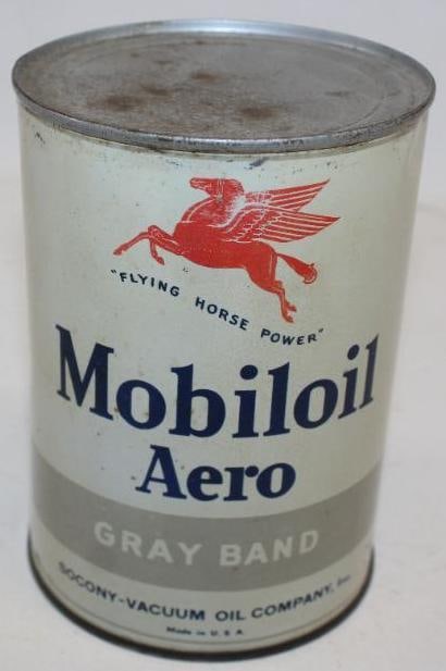 Socony-Vacuum Mobiloil Aero Gray Band One Quart Metal Oil Can: This can is in very good condition with some staining in the white areas. There is a dent near the seam. The reverse has some additional discoloration to the white areas. This oil can is full. This ca