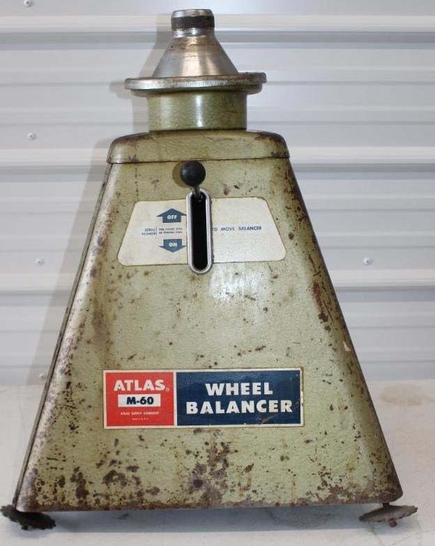 Atlas M-60 Tire Wheel Balancer: 20" x 20" x 23" does not appear to be in working condition, missing a leveling foot
