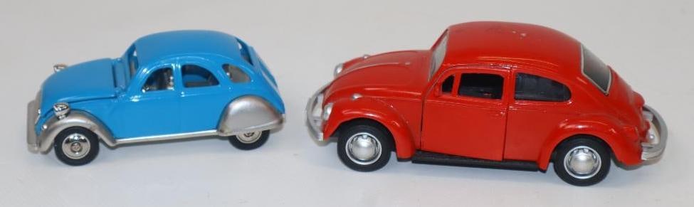 Group of 2 Volkswagen Beetle & Renault Diecast Cars: Largest is 5" x 2" x 1.5" blue car has fossil watch under hood