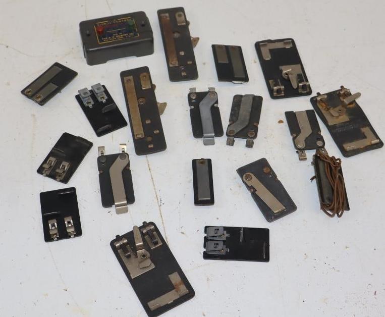 Group of 19 0 Gauge Train Track Transfer Clips: largest 1.5" x 2.5"