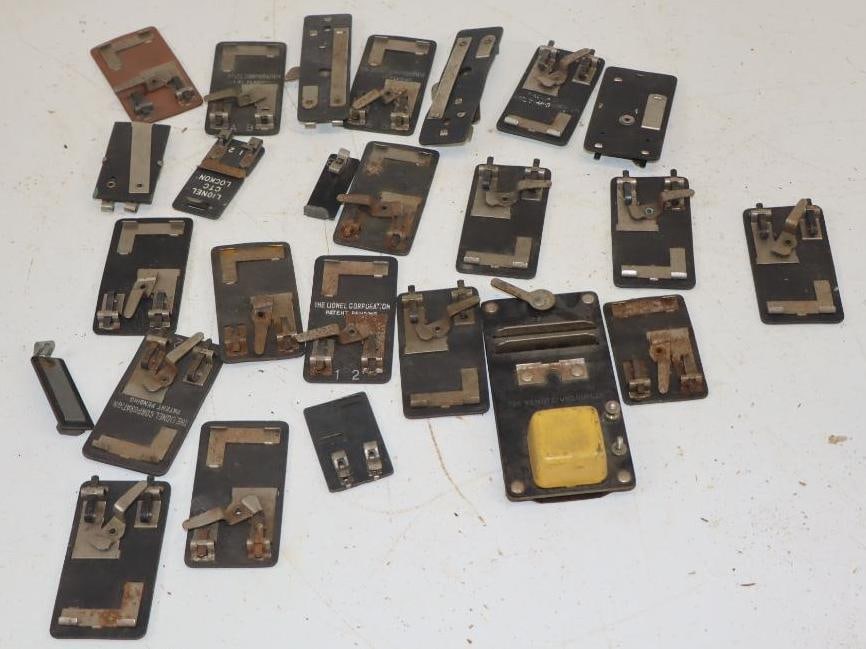 Group of 25 0 Gauge Train Track Transfer Clips: largest 1.5" x 2.5"