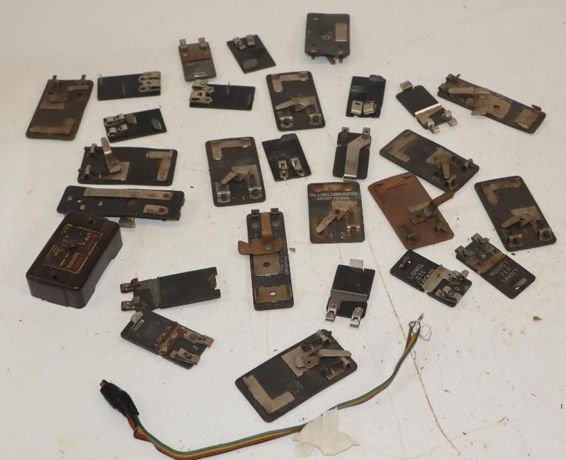 Group of 24 0 Gauge Train Track Transfer Clips: largest 1.5" x 2.5"