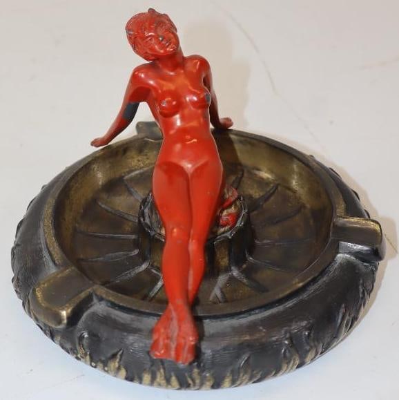 1934 Overman Cushion Tire Figural Female Devil Ashtray: This ashtray has excellent original paint with some minor wear throughout. 5" x 7" x 7".