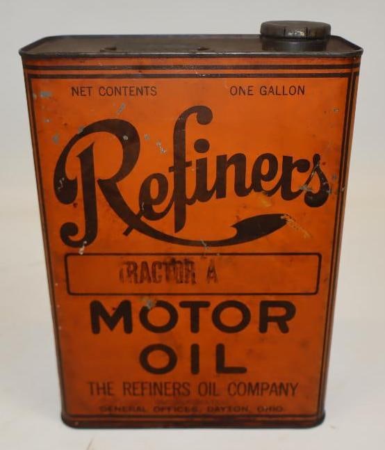 Refiners Tractor 1 Gallon Motor Oil Can: The display side shows light wear and discoloration. The reverse has slightly more wear. 10.5" x 7.5" x 3.5". Graded 8.25 and 8.