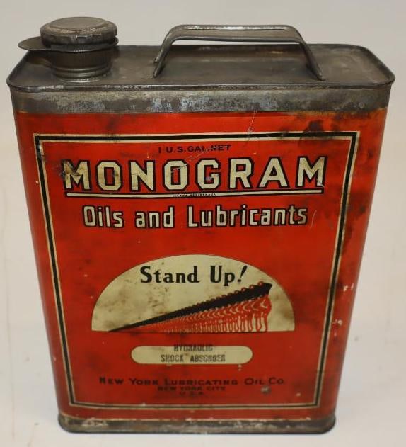 Monogram "Stand Up" Graphic 1 Gallon Motor Oil Can: This can displays very well with only minor surface scratches on the display side and some staining on the reverse. 11" x 8" x 3". Graded 8.5 and 8.25.