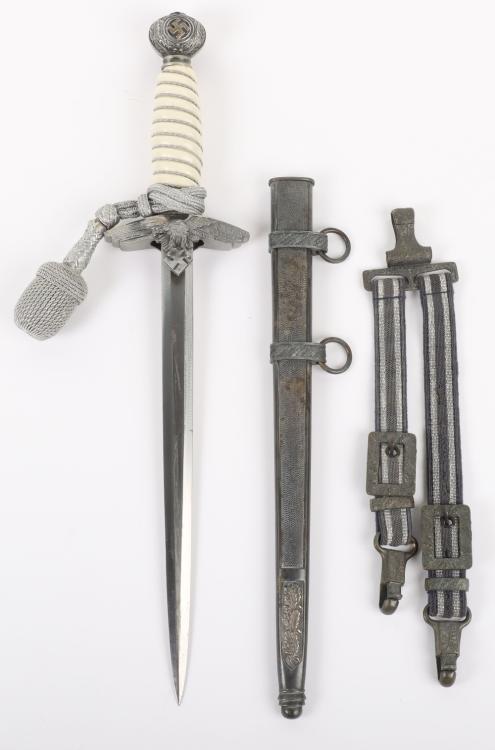 WW2 German Luftwaffe 2nd Pattern Officers Dress Dagger: WW2 German Luftwaffe 2nd Pattern Officers Dress Dagger with Straps and Portepee, good untouched example with a white celluloid grip retaining the original wire binding. Top pommel with remains of the